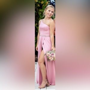 Blush, one shoulder David’s Bridal bridesmaid dress with belt.